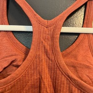 Burnt orange lululemon Ebb to street tank top
